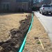 Underground PVC drain installation in process